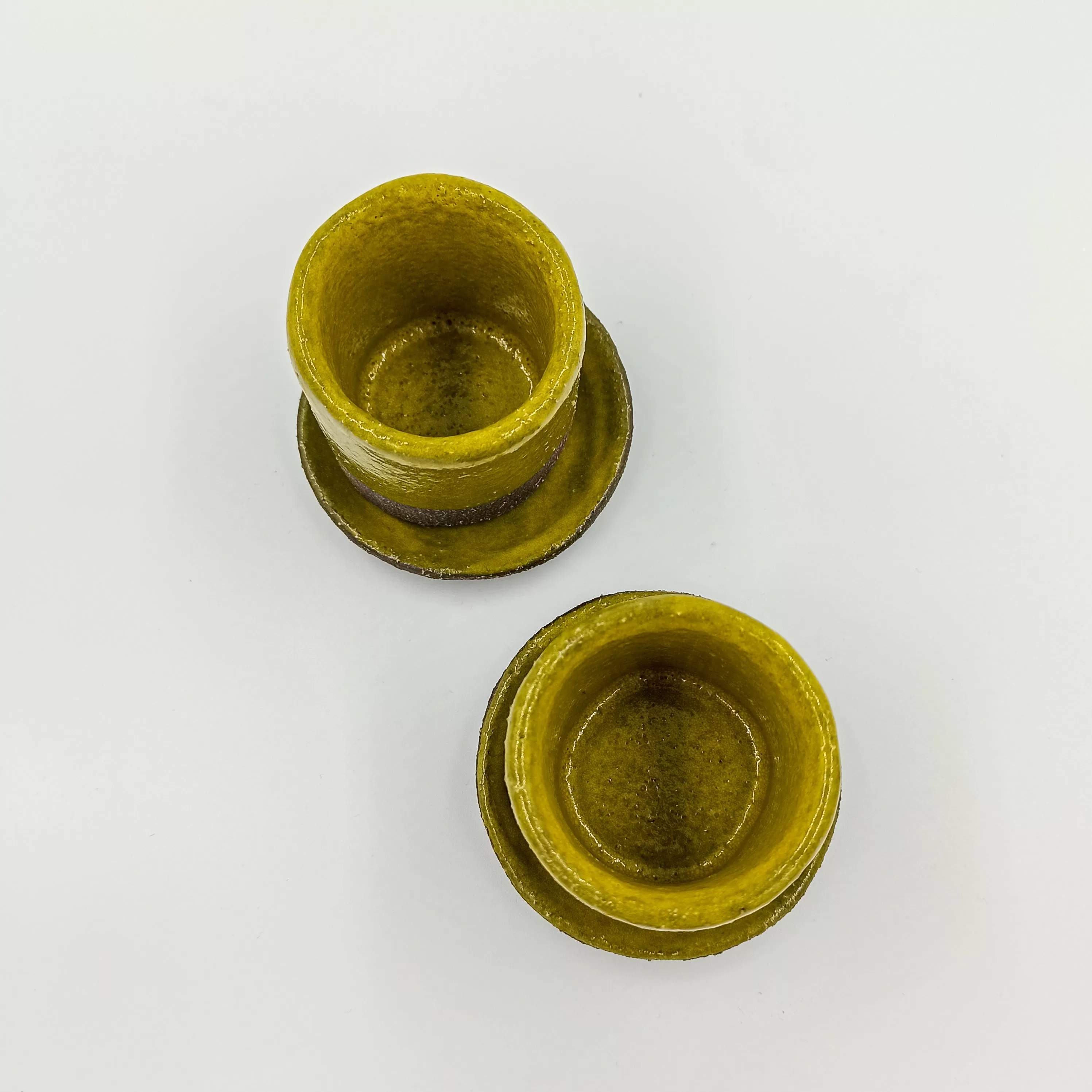 Handbuilt ceramic espresso cup in yellow